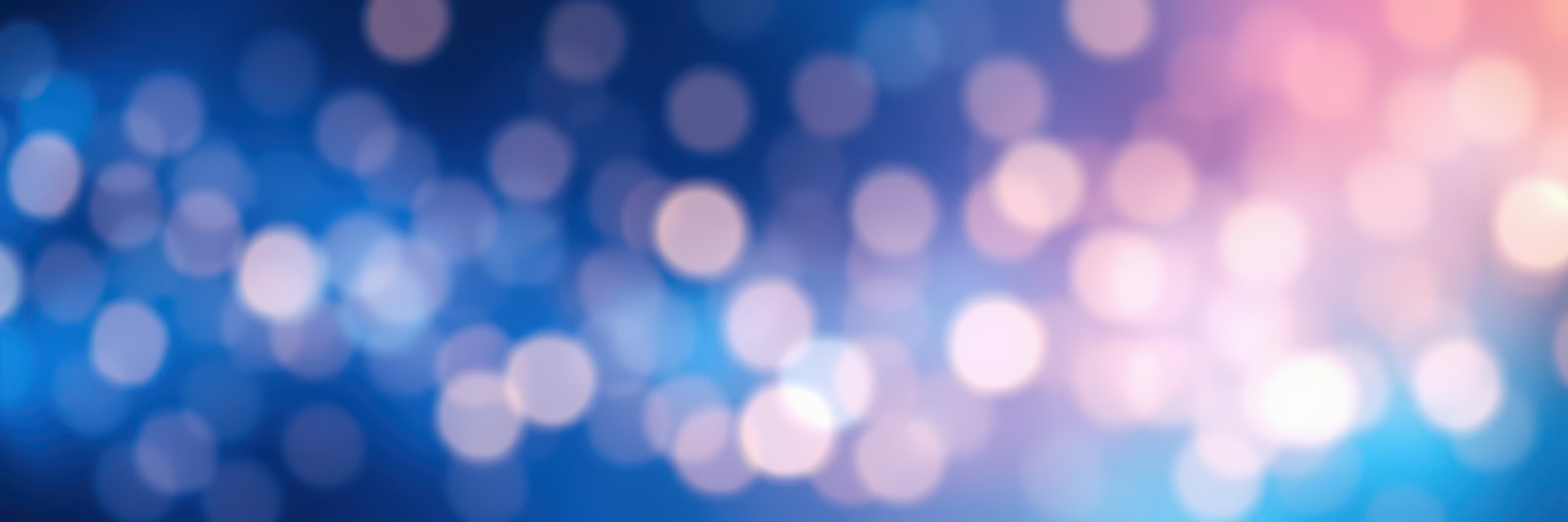 Colorful bokeh lights create a dreamy atmosphere in a nighttime setting at a celebration or gathering